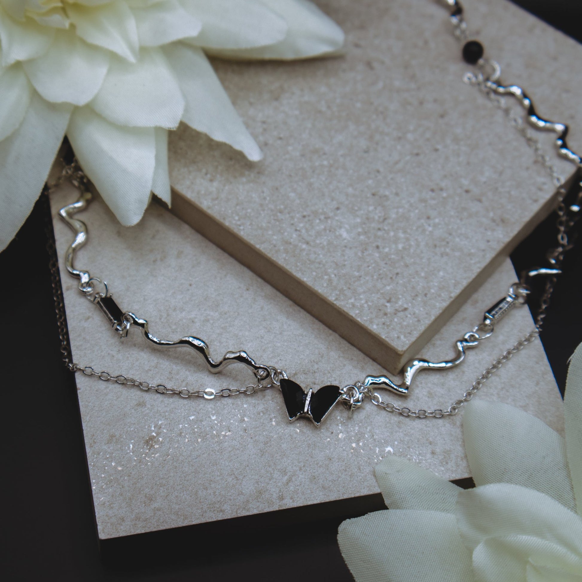 Edgy black butterfly layered necklace