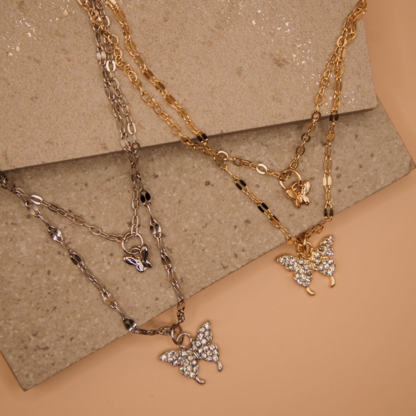 Layered butterfly pendant necklace, gold and silver