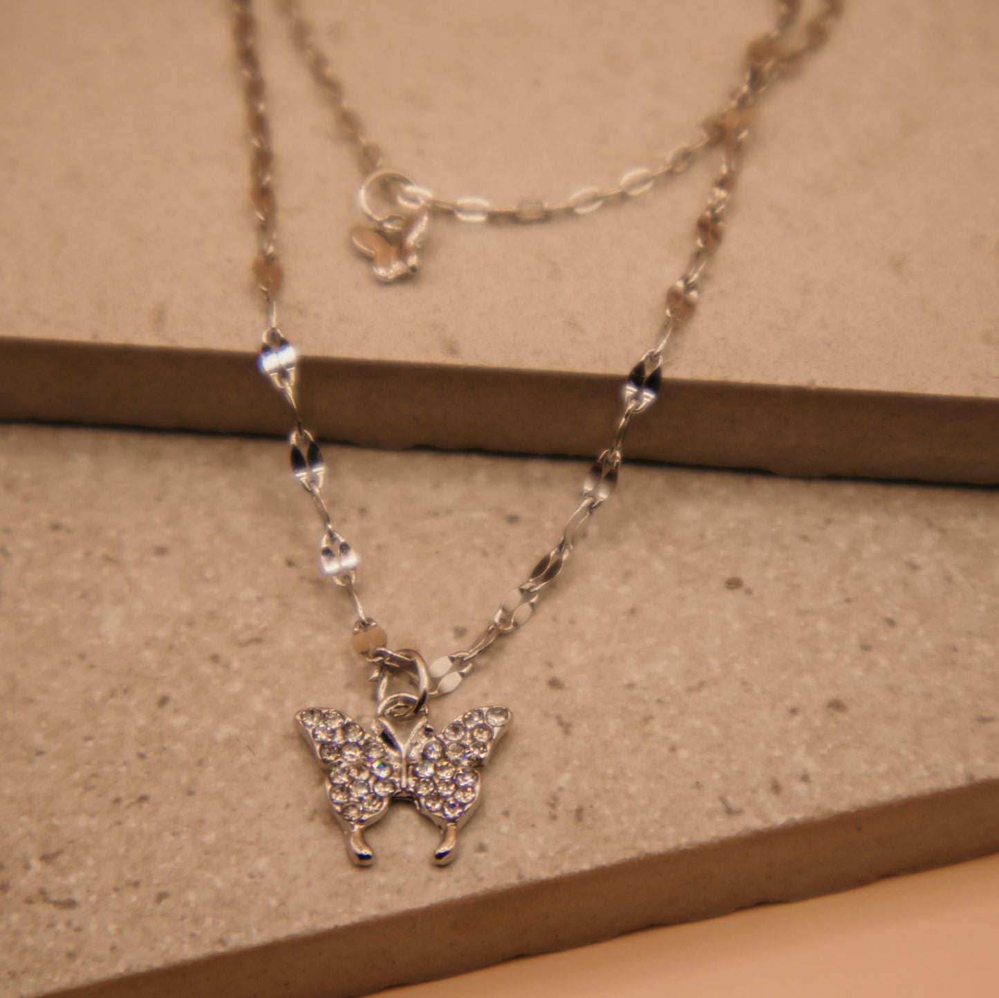 Layered butterfly pendant necklace, gold and silver