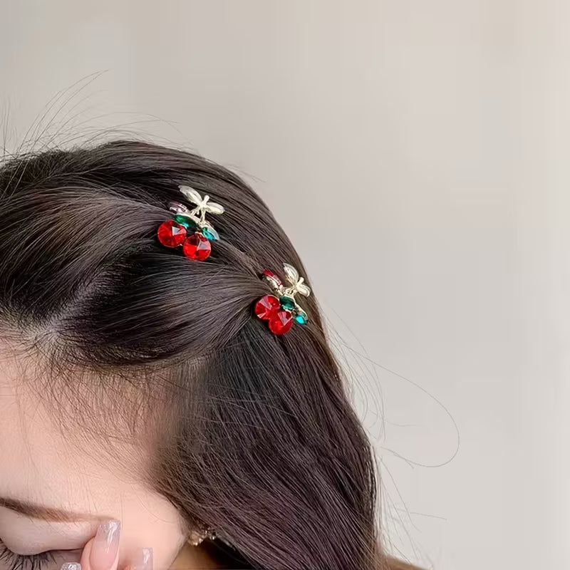 Cherry Gem Hair Clips on model, green and red