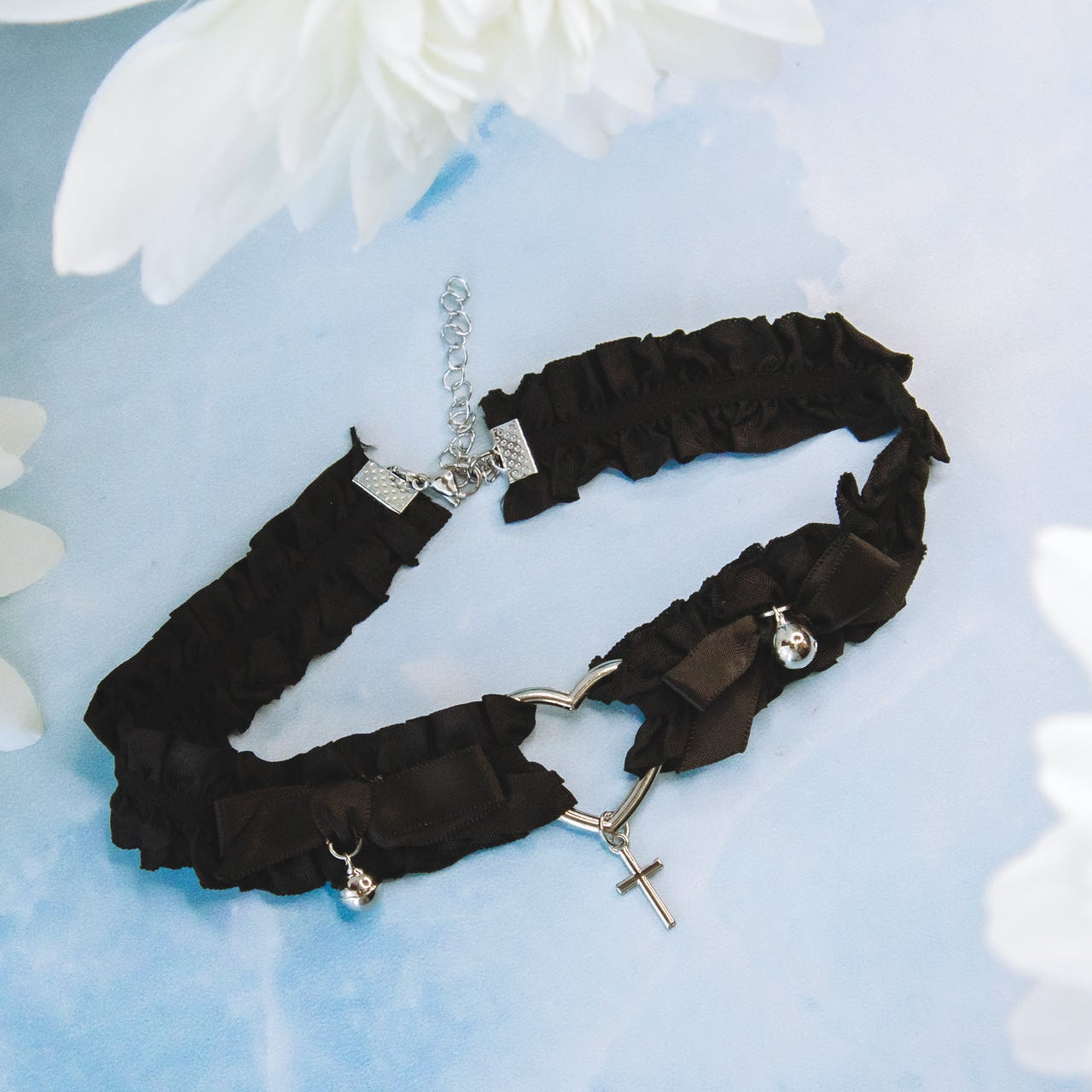 black ribbon choker with bell and silver heart details